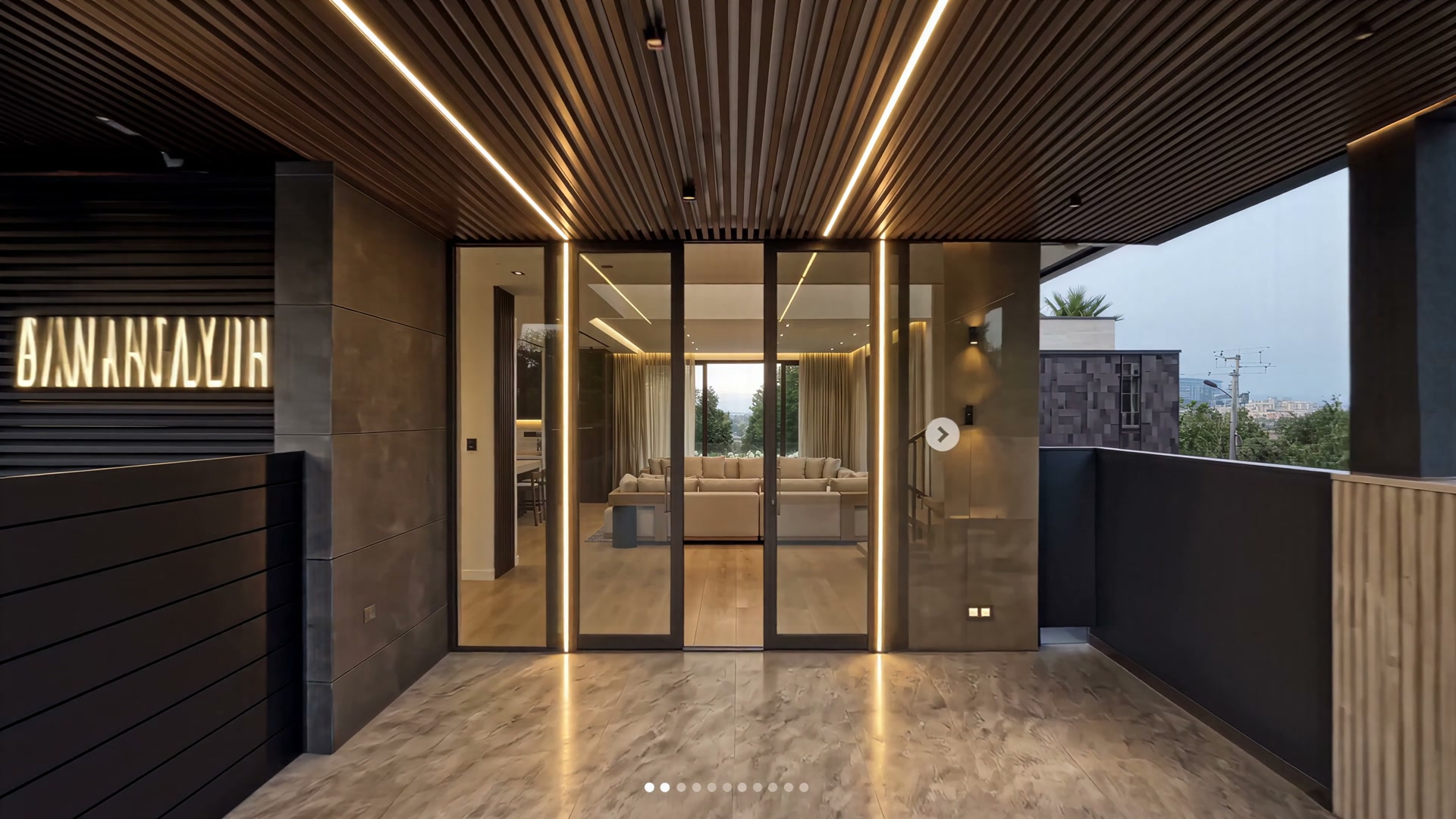 Entry vestibule with slatted oak ceiling and limestone walls